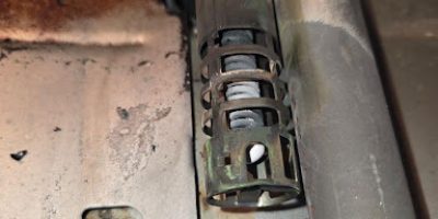The original GE bake igniter appeared intact but tested weak, causing unreliable oven heating.